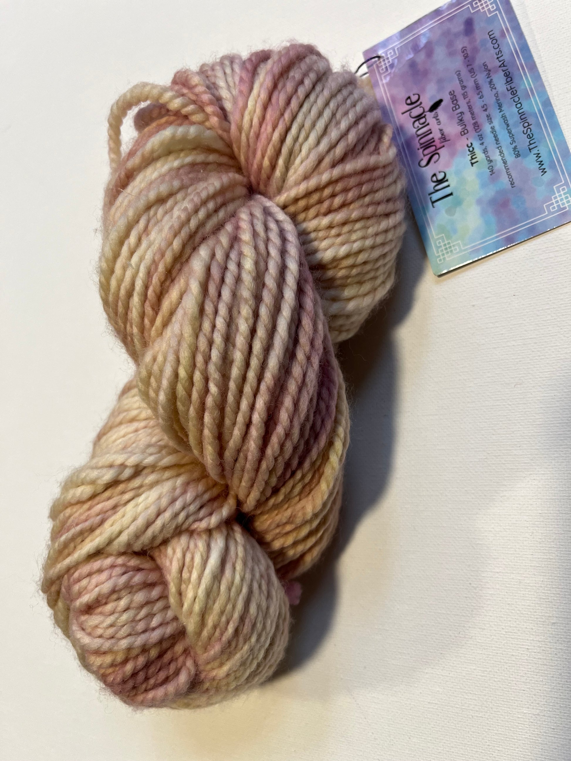 Thick bulky base yarn skein in soft pastel shades with The Spinnacle fiber arts label